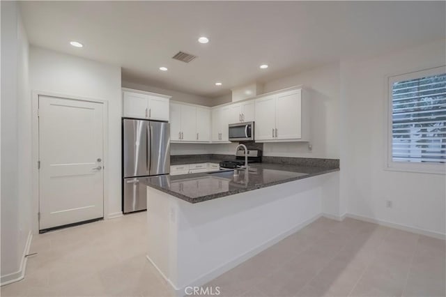 556 W Baseline Rd, Claremont, CA 91711 - kitchen featuring white cabinetry, visible vents, a peninsula, and appliances with stainless steel finishes