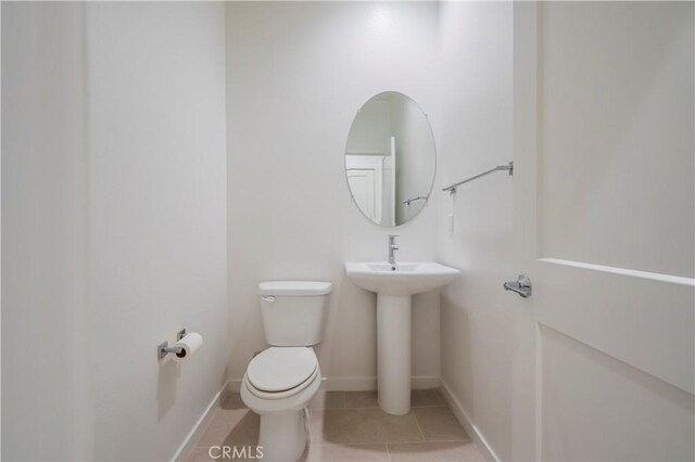 556 W Baseline Rd, Claremont, CA 91711 - bathroom with toilet, tile patterned flooring, and baseboards