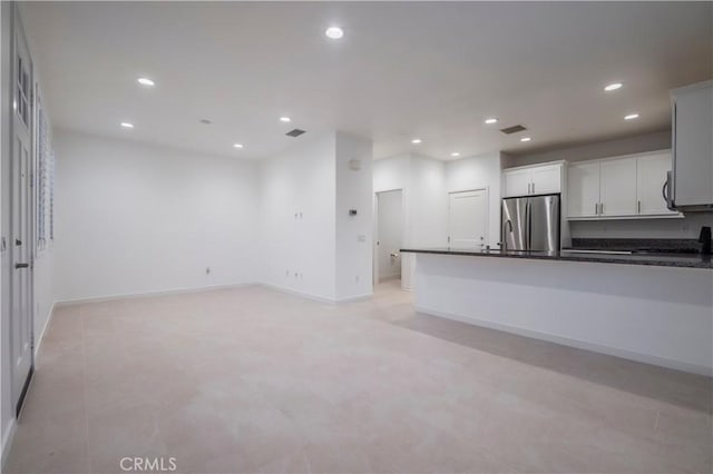 556 W Baseline Rd, Claremont, CA 91711 - kitchen with dark countertops, visible vents, freestanding refrigerator, baseboards, and recessed lighting