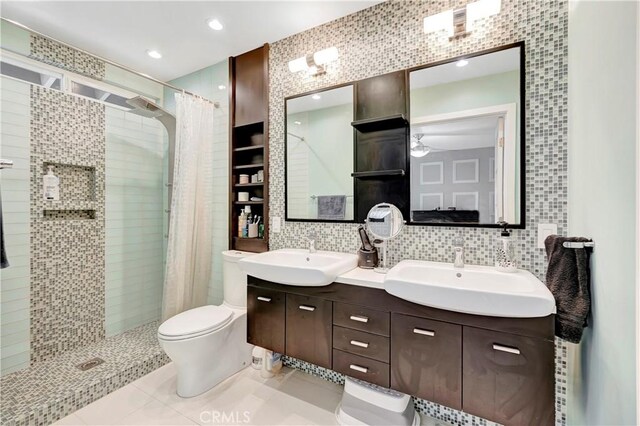 1541 Westcastle, West Covina, CA 91791 - bathroom featuring tile walls, a shower stall, toilet, double vanity, and tile patterned floors