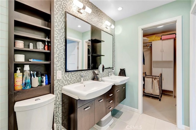 1541 Westcastle, West Covina, CA 91791 - bathroom with double vanity, a walk in closet, toilet, backsplash, and tile patterned flooring