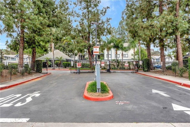 1541 Westcastle, West Covina, CA 91791 - view of asphalt street with sidewalks, a gate, curbs, a gated entry, and a residential view