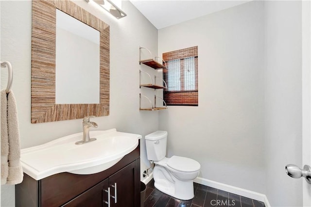 1541 Westcastle, West Covina, CA 91791 - bathroom with toilet, vanity, and baseboards