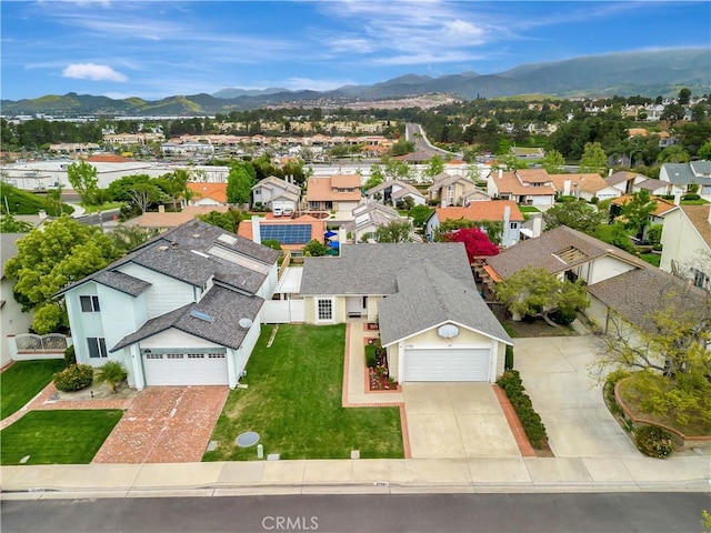 birds eye view of property featuring a mountain view and a residential view