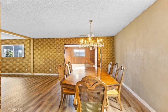 20908 New Hampshire Ave, Torrance, CA 90502 - dining room with a chandelier, baseboards, wood finished floors, and a textured ceiling