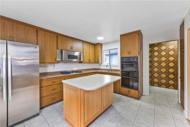 20908 New Hampshire Ave, Torrance, CA 90502 - kitchen featuring stainless steel appliances, a sink, a kitchen island, light countertops, and brown cabinets