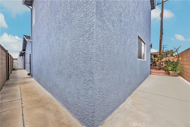 20908 New Hampshire Ave, Torrance, CA 90502 - view of property exterior with stucco siding, a fenced backyard, and a patio area