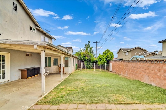 view of yard featuring a fenced backyard and a patio