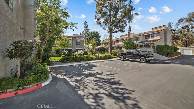 view of street featuring curbs and a residential view