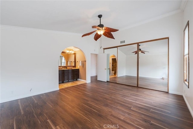 4397 N Skylark Ct, Moorpark, CA 93021 - interior space with crown molding, arched walkways, baseboards, wood finished floors, and visible vents