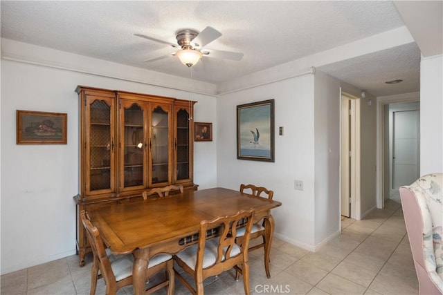 124 Via Estrada Unit D, Laguna Woods, CA 92637 - dining space with a textured ceiling, a ceiling fan, baseboards, and light tile patterned floors