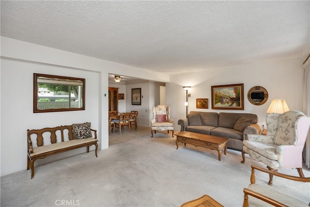 124 Via Estrada Unit D, Laguna Woods, CA 92637 - living room with a textured ceiling and carpet floors