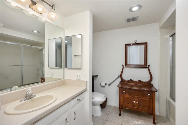 124 Via Estrada Unit D, Laguna Woods, CA 92637 - bathroom featuring vanity, tile patterned floors, toilet, visible vents, and a shower with door
