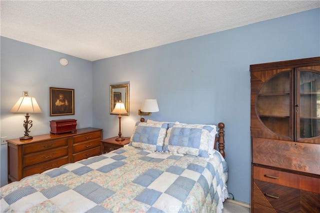124 Via Estrada Unit D, Laguna Woods, CA 92637 - bedroom featuring carpet floors and a textured ceiling