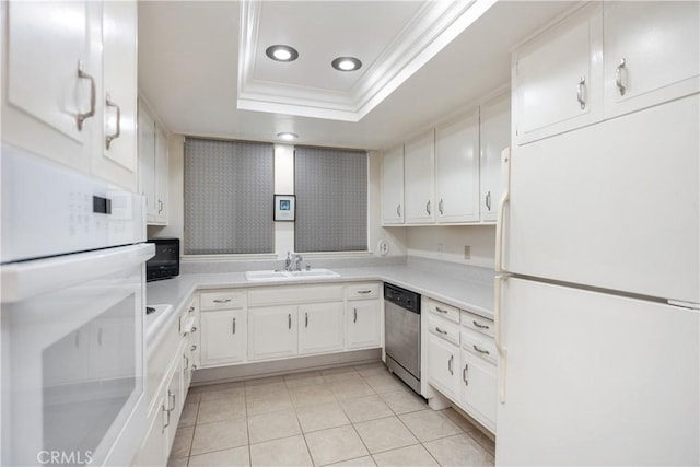 124 Via Estrada Unit D, Laguna Woods, CA 92637 - kitchen with white appliances, light tile patterned floors, ornamental molding, a sink, and a tray ceiling