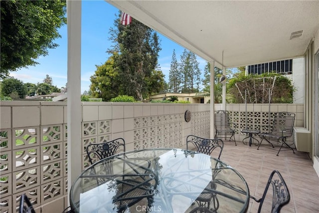 124 Via Estrada Unit D, Laguna Woods, CA 92637 - view of patio featuring outdoor dining space and visible vents