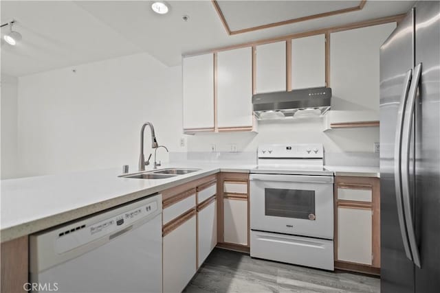 2960 Champion Way Unit 2706, Tustin, CA 92782 - kitchen with white appliances, a sink, extractor fan, light wood-style floors, and light countertops