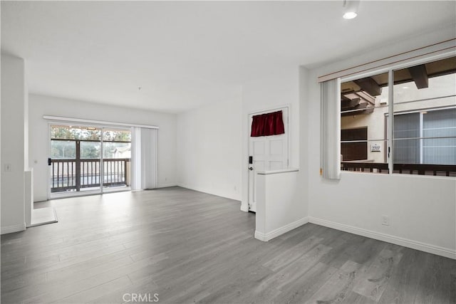 2960 Champion Way Unit 2706, Tustin, CA 92782 - empty room with baseboards and wood finished floors