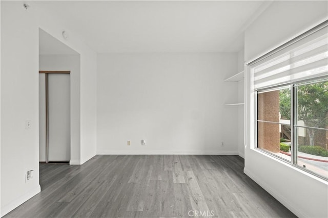 2960 Champion Way Unit 2706, Tustin, CA 92782 - empty room featuring baseboards and wood finished floors