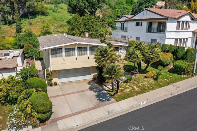 851 Crest Vista Dr, Monterey Park, CA 91754 - view of front of home with driveway, stucco siding, and an attached garage