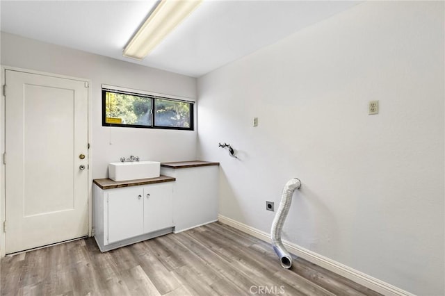 851 Crest Vista Dr, Monterey Park, CA 91754 - washroom featuring a sink, cabinet space, light wood-type flooring, electric dryer hookup, and baseboards