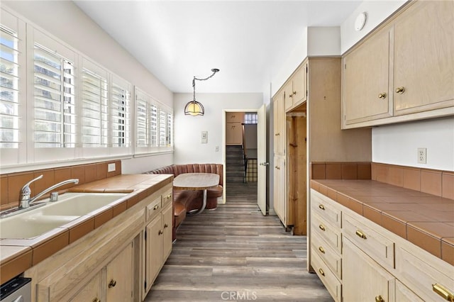 851 Crest Vista Dr, Monterey Park, CA 91754 - kitchen featuring a sink, wood finished floors, hanging light fixtures, and tile countertops