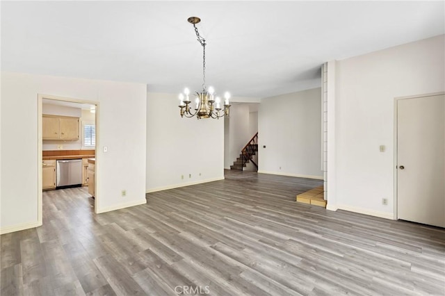 851 Crest Vista Dr, Monterey Park, CA 91754 - unfurnished dining area featuring baseboards, an inviting chandelier, stairs, and light wood-style flooring