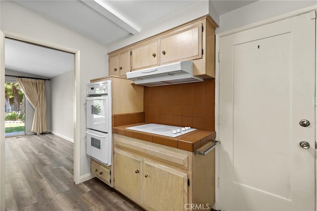 851 Crest Vista Dr, Monterey Park, CA 91754 - kitchen featuring dark wood finished floors, white appliances, decorative backsplash, under cabinet range hood, and tile counters