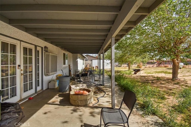 view of patio featuring outdoor dining space and french doors