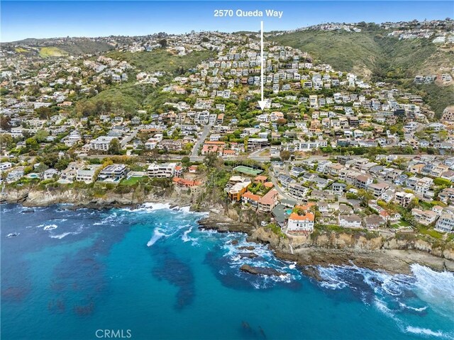 birds eye view of property featuring a water and mountain view and a residential view