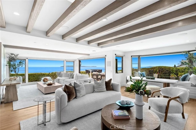living room with recessed lighting, light wood finished floors, and beamed ceiling