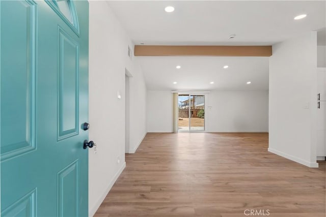 foyer with recessed lighting, light wood finished floors, and baseboards