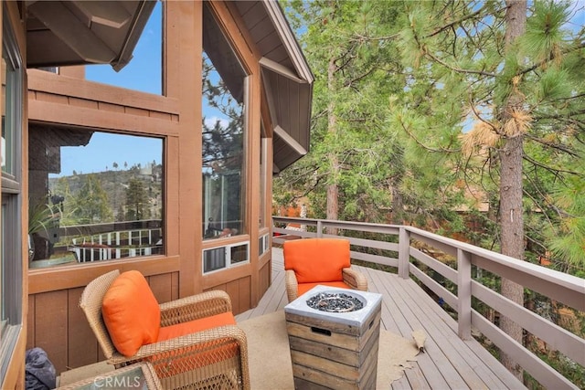 825 Grass Valley Rd, Lake Arrowhead, CA 92352 - wooden terrace with an outdoor fire pit