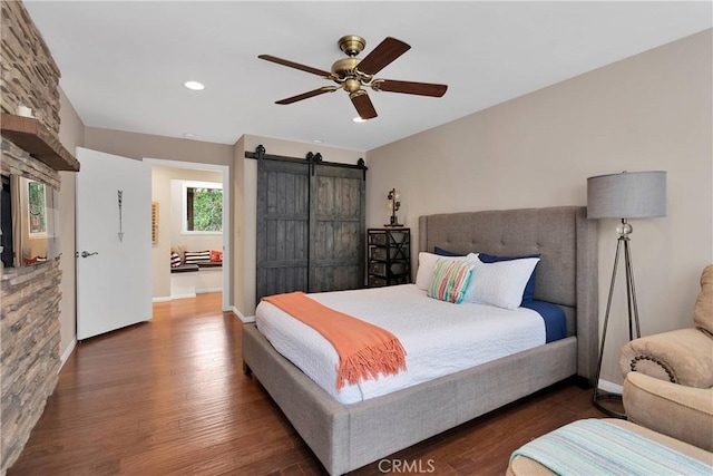 825 Grass Valley Rd, Lake Arrowhead, CA 92352 - bedroom featuring recessed lighting, a barn door, ceiling fan, baseboards, and wood finished floors