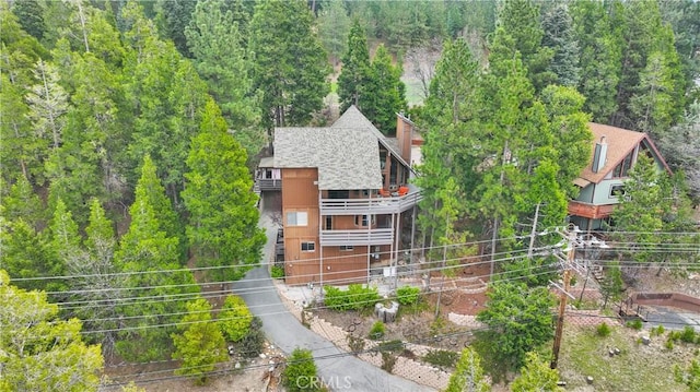 825 Grass Valley Rd, Lake Arrowhead, CA 92352 - exterior space with a wooded view, roof with shingles, fence, and a balcony