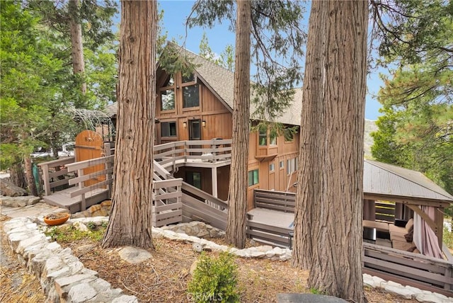 825 Grass Valley Rd, Lake Arrowhead, CA 92352 - exterior space with a wooden deck and roof with shingles