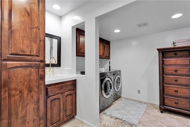 825 Grass Valley Rd, Lake Arrowhead, CA 92352 - laundry room featuring a sink, cabinet space, independent washer and dryer, light tile patterned floors, and visible vents