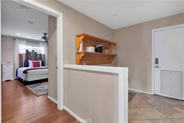825 Grass Valley Rd, Lake Arrowhead, CA 92352 - hallway featuring recessed lighting, light wood-style floors, and baseboards