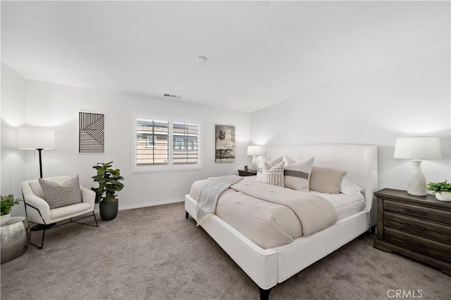 bedroom with baseboards, visible vents, and carpet flooring