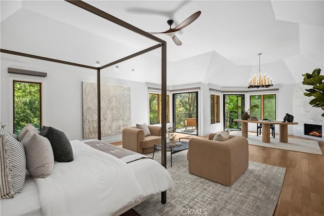 1935 Maverick Ln, North Tustin, CA 92705 - bedroom with wood finished floors, a fireplace, multiple windows, and lofted ceiling