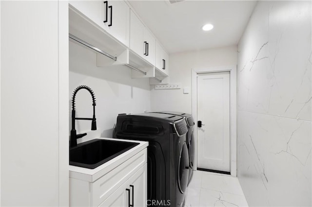 1935 Maverick Ln, North Tustin, CA 92705 - laundry room featuring recessed lighting, washer and dryer, cabinet space, marble finish floor, and a sink