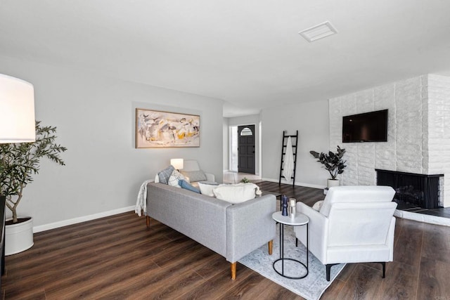 3185 Monroe St, Carlsbad, CA 92008 - living area with wood finished floors, baseboards, and a fireplace
