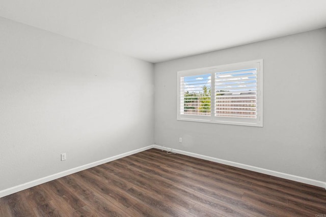 3185 Monroe St, Carlsbad, CA 92008 - spare room featuring dark wood-style floors and baseboards