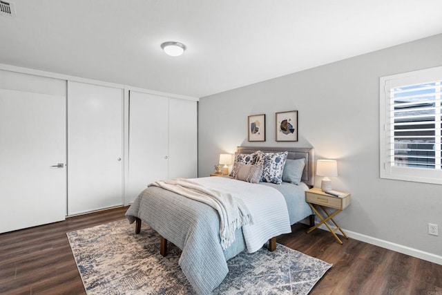 3185 Monroe St, Carlsbad, CA 92008 - bedroom featuring wood finished floors and multiple closets