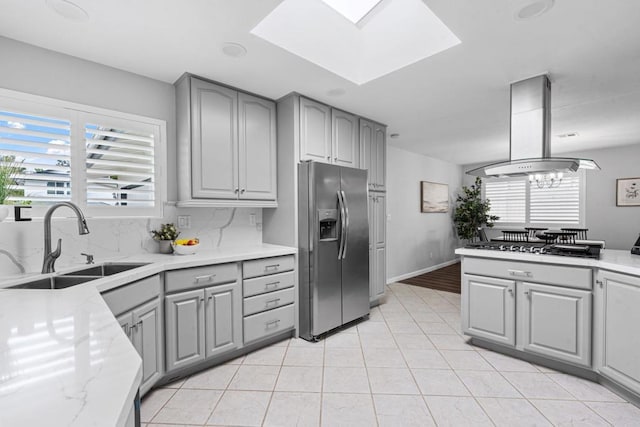 3185 Monroe St, Carlsbad, CA 92008 - kitchen with stainless steel refrigerator with ice dispenser, gray cabinets, a sink, and plenty of natural light