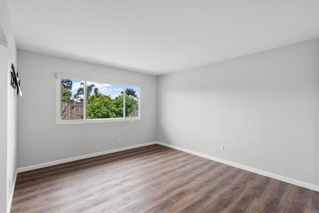 3185 Monroe St, Carlsbad, CA 92008 - empty room featuring wood finished floors and baseboards
