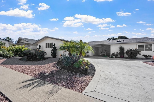 3185 Monroe St, Carlsbad, CA 92008 - ranch-style house featuring curved driveway and stucco siding