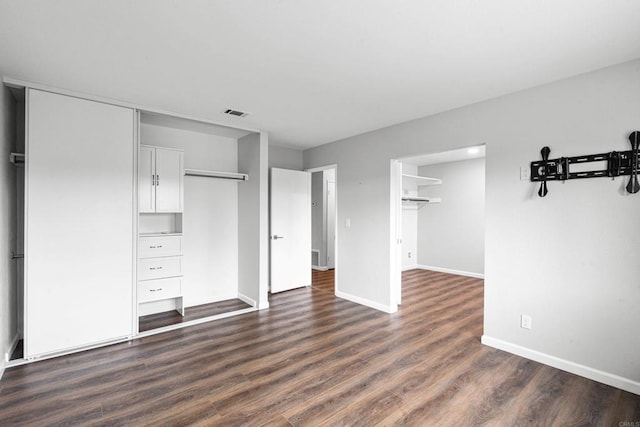 3185 Monroe St, Carlsbad, CA 92008 - unfurnished bedroom featuring dark wood-style flooring, baseboards, and a closet