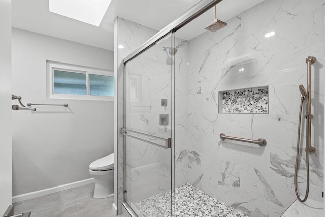 3185 Monroe St, Carlsbad, CA 92008 - full bath featuring toilet, a marble finish shower, baseboards, and a skylight