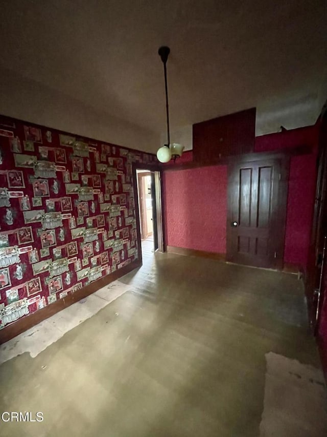 unfurnished dining area featuring tile patterned floors and baseboards